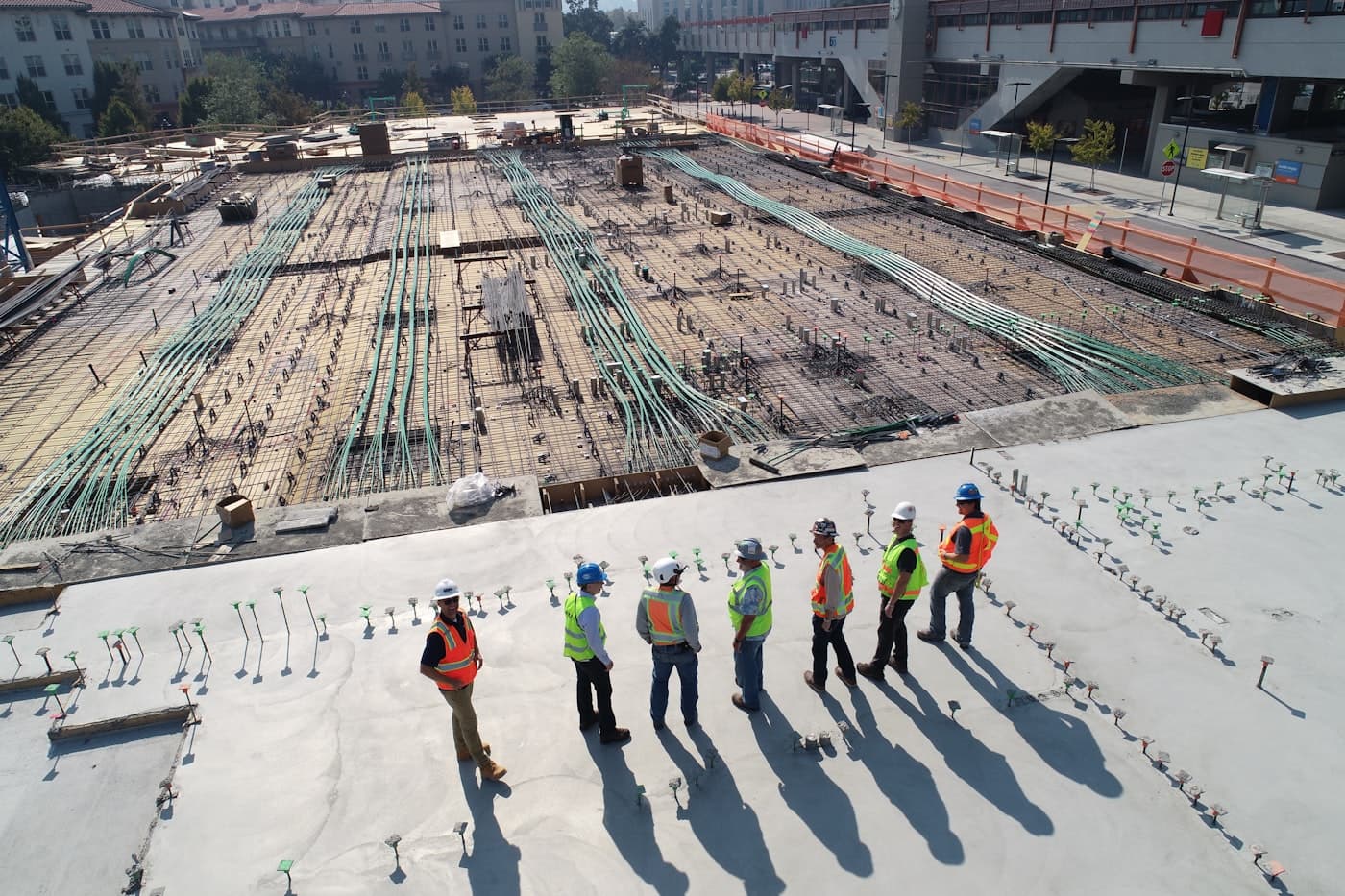 Tradies gathered on an active construction slab